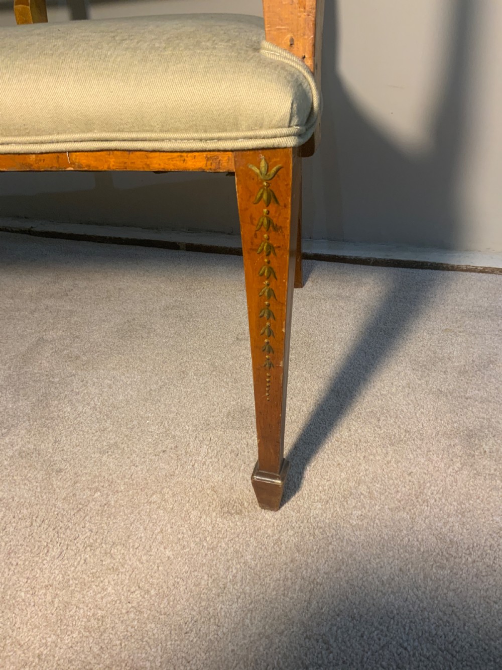 An early 19th-century Regency satinwood chair-back settee featuring three painted portrait medallions and light green fabric upholstery. View VII
