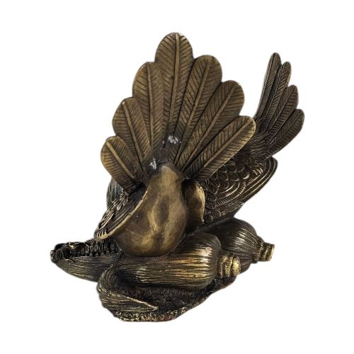 fig 1. A pair of cast bronze doves with detailed feather chasing and fanned tail feathers perched together on a maize cob base.