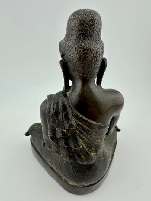 fig 3. A 19th-century Burmese cast bronze seated Shakyamuni Buddha statue depicting the Bhumisparsha mudra with a dark patinated finish.