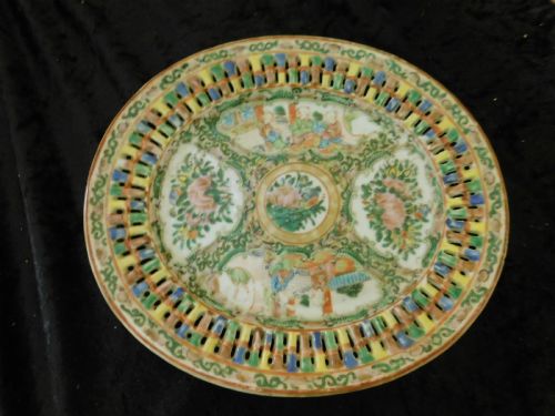 fig 1. A 19th-century Chinese Famille Rose reticulated porcelain basket and matching pierced underplate decorated with polychrome floral and figurative motifs.