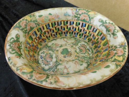 fig 2. A 19th-century Chinese Famille Rose reticulated porcelain basket and matching pierced underplate decorated with polychrome floral and figurative motifs.