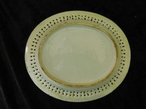 fig 5. A 19th-century Chinese Famille Rose reticulated porcelain basket and matching pierced underplate decorated with polychrome floral and figurative motifs.