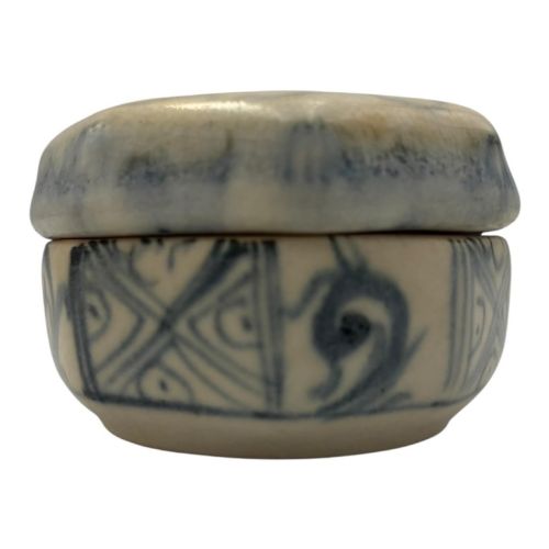 fig 2. Small octagonal ceramic covered box featuring off-white glaze and hand-painted blue cobalt scroll motifs.