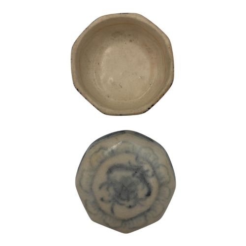 fig 4. Small octagonal ceramic covered box featuring off-white glaze and hand-painted blue cobalt scroll motifs.