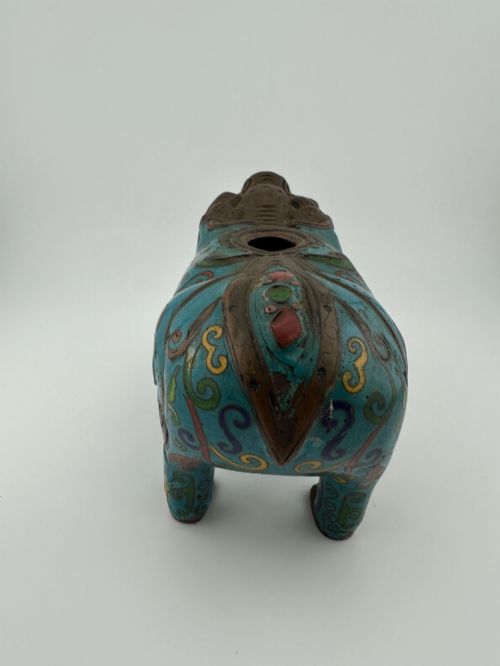 fig 4. An antique Chinese bronze censer shaped as a mythical beast decorated with turquoise cloisonne enamel and colourful scrollwork.