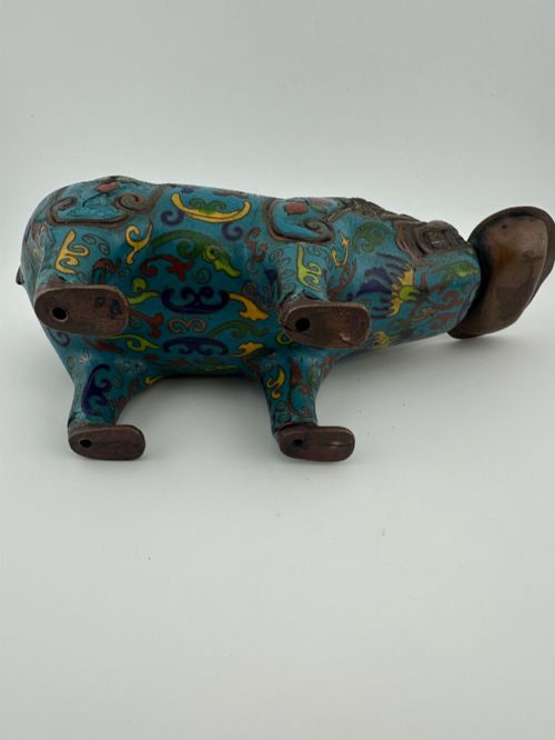 fig 6. An antique Chinese bronze censer shaped as a mythical beast decorated with turquoise cloisonne enamel and colourful scrollwork.