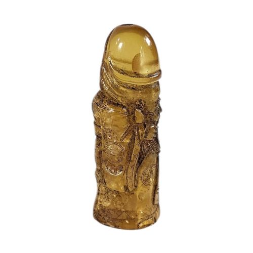 fig 1. A hand-carved honey amber pendant depicting the Chinese deity Shoulao with incised robe detailing and a high domed head.