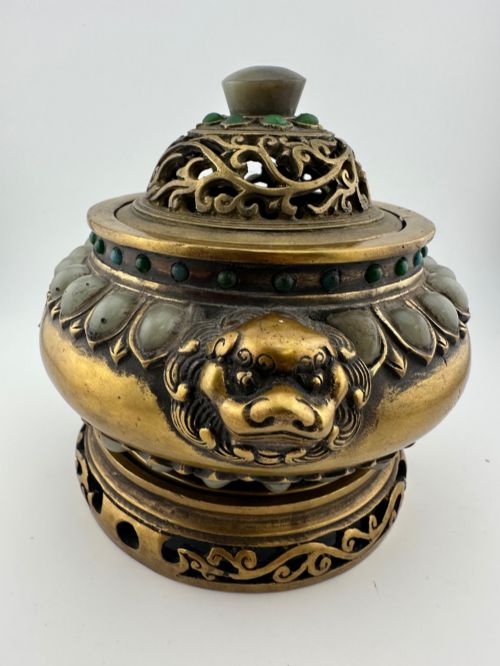 fig 3. An antique gilded bronze Chinese censer featuring hardstone and jade cabochon inlays, beast-head handles, a pierced cover, and a matching carved stand.
