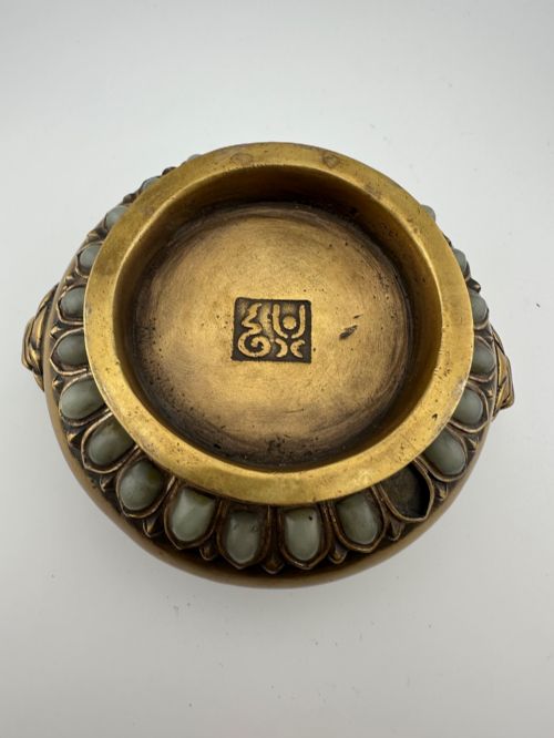 fig 4. An antique gilded bronze Chinese censer featuring hardstone and jade cabochon inlays, beast-head handles, a pierced cover, and a matching carved stand.
