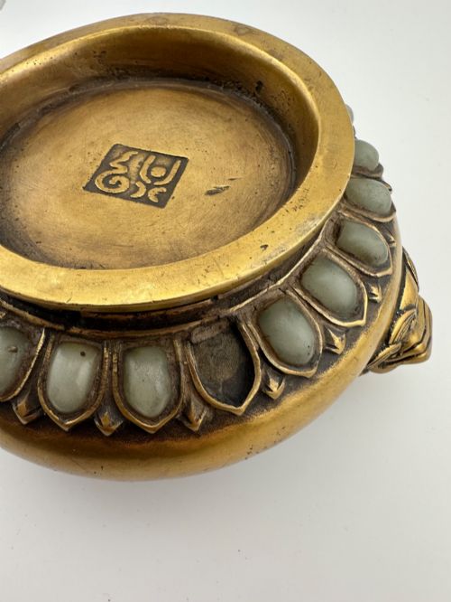 fig 5. An antique gilded bronze Chinese censer featuring hardstone and jade cabochon inlays, beast-head handles, a pierced cover, and a matching carved stand.