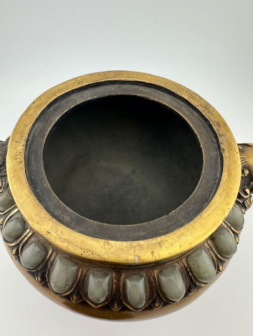 fig 6. An antique gilded bronze Chinese censer featuring hardstone and jade cabochon inlays, beast-head handles, a pierced cover, and a matching carved stand.