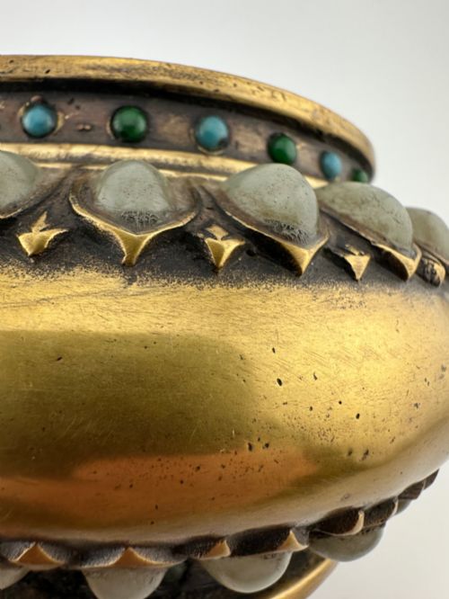 fig 7. An antique gilded bronze Chinese censer featuring hardstone and jade cabochon inlays, beast-head handles, a pierced cover, and a matching carved stand.