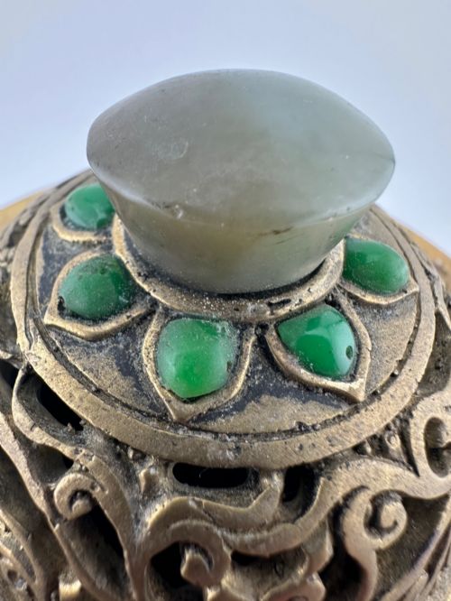 fig 8. An antique gilded bronze Chinese censer featuring hardstone and jade cabochon inlays, beast-head handles, a pierced cover, and a matching carved stand.