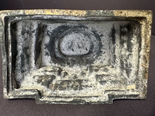 fig 4. A dark bronze Tibetan sculpture depicting eleven-headed Avalokiteshvara with radiating arms set against a halo mandorla on a lotus pedestal.