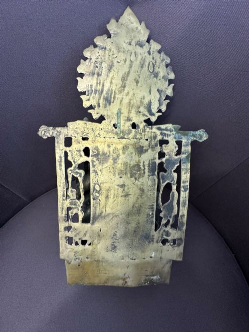 fig 5. An antique cast bronze figure of Green Tara seated on an elaborate throne with a flaming halo backpiece and visible green patination.