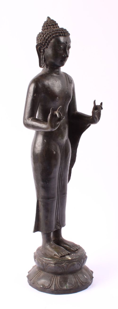fig 2. A 19th-century Thai Rattanakosin bronze standing Buddha figure depicted in double mudra posture mounted on a tiered lotus pedestal.