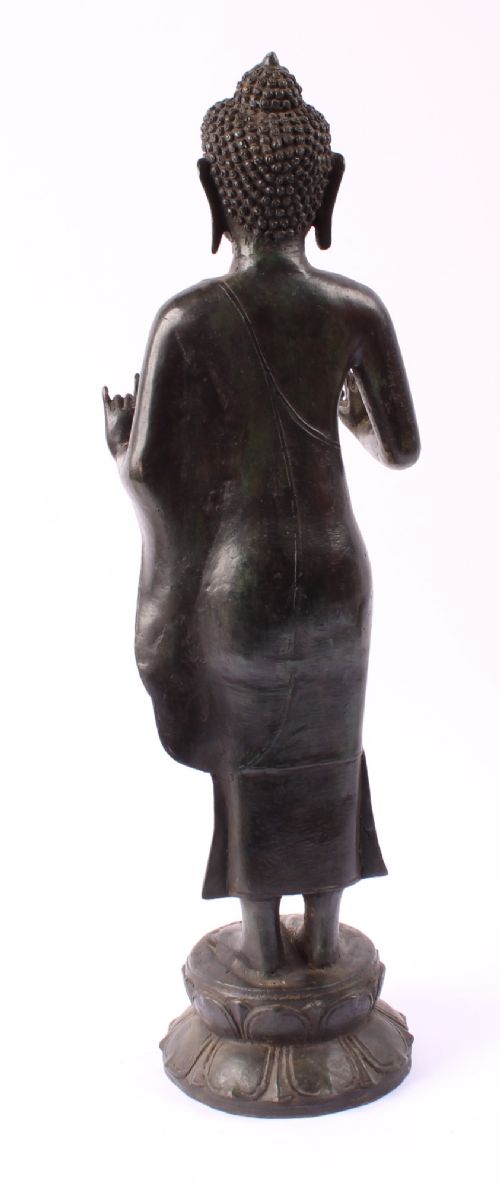 fig 3. A 19th-century Thai Rattanakosin bronze standing Buddha figure depicted in double mudra posture mounted on a tiered lotus pedestal.