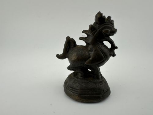 fig 3. A set of six dark bronze zoomorphic trade weights depicting various animals mounted on octagonal and circular pedestals.