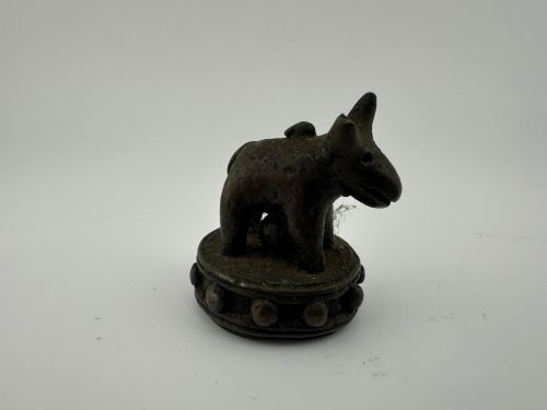 fig 4. A set of six dark bronze zoomorphic trade weights depicting various animals mounted on octagonal and circular pedestals.