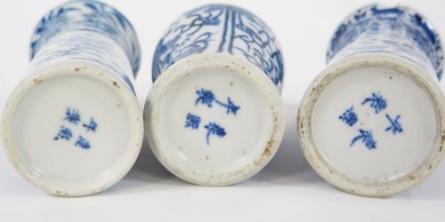 fig 1. A set of three 19th-century Chinese blue and white porcelain vases featuring hand-painted floral motifs and figurative scenes.
