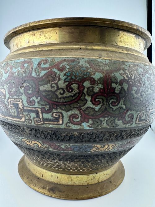 fig 1. A set of three bulbous antique Chinese bronze jardinieres featuring colourful champleve enamel floral decoration around their midsections.
