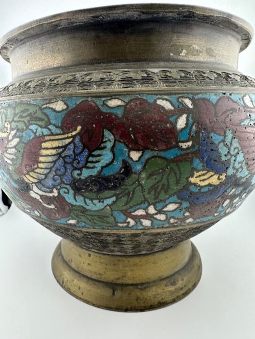 fig 2. A set of three bulbous antique Chinese bronze jardinieres featuring colourful champleve enamel floral decoration around their midsections.