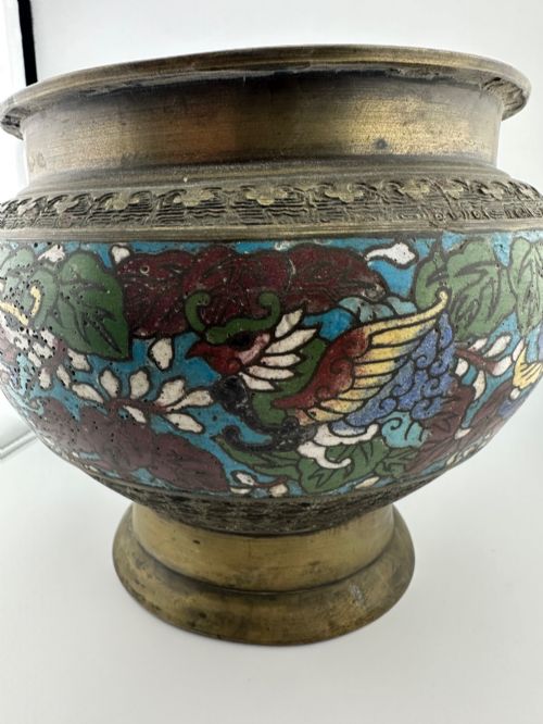 fig 3. A set of three bulbous antique Chinese bronze jardinieres featuring colourful champleve enamel floral decoration around their midsections.