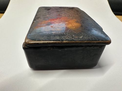 fig 2. A small rectangular mid-19th-century Chinese export black lacquer box with a gilded decorated lid showing surface age and patina.