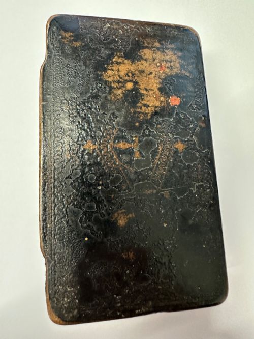 fig 3. A small rectangular mid-19th-century Chinese export black lacquer box with a gilded decorated lid showing surface age and patina.