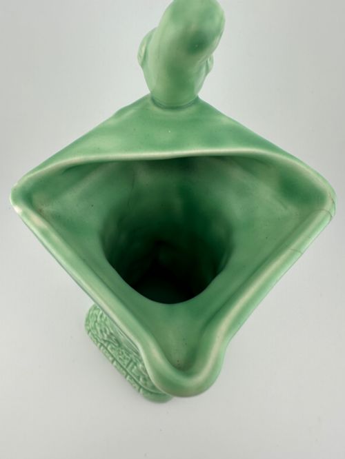 fig 3. A pale green glazed earthenware Art Deco ceramic jug featuring relief brickwork and a sculpted bird perched on the handle.