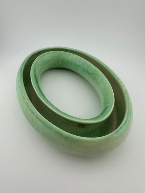fig 1. A 1930s oval ceramic posy ring vase with a mottled green glaze, featuring a hollow ring trough designed for short floral stems.