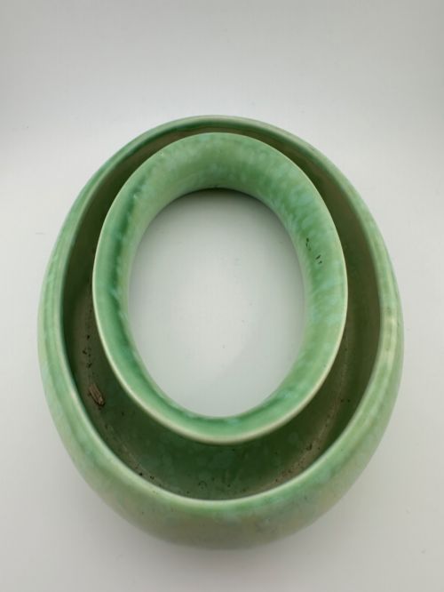 fig 3. A 1930s oval ceramic posy ring vase with a mottled green glaze, featuring a hollow ring trough designed for short floral stems.