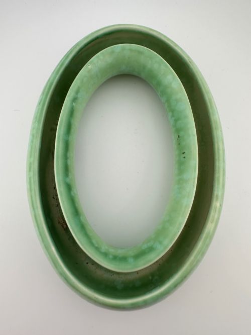 fig 4. A 1930s oval ceramic posy ring vase with a mottled green glaze, featuring a hollow ring trough designed for short floral stems.