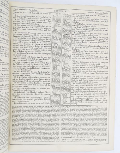 fig 2. A dark leather-bound Victorian Holy Bible featuring gilt lettering inside a star-shaped frame and decorative brass corner mounts.