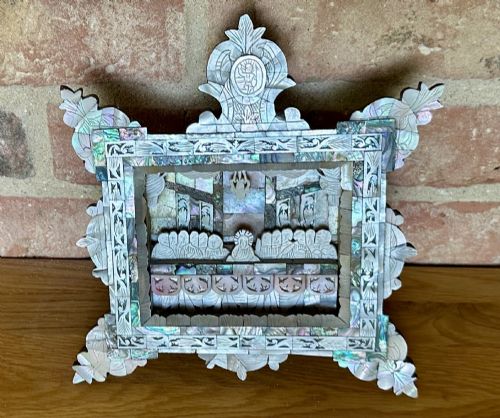 fig 1. An antique hand-carved mother of pearl and abalone shell diorama frame depicting the Last Supper with elaborate cresting.