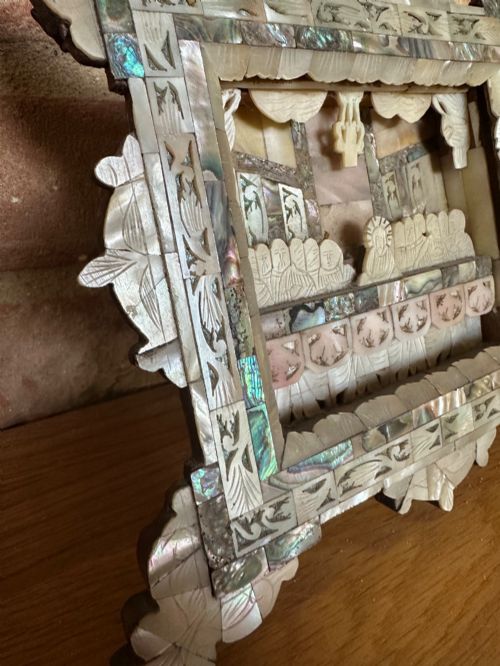 fig 3. An antique hand-carved mother of pearl and abalone shell diorama frame depicting the Last Supper with elaborate cresting.