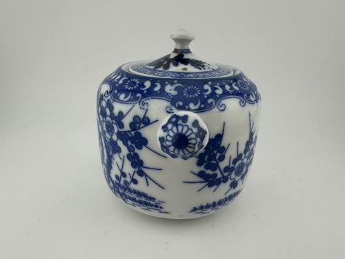 fig 3. A Japanese Meiji period blue and white porcelain incense burner decorated with hand-painted prunus branches, featuring a fitted lid and side lugs.