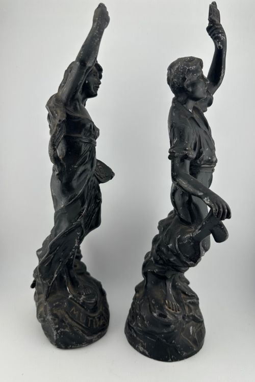 fig 6. A pair of dark bronze-finished French spelter allegorical figures raised on moulded circular bases representing Mutualite and Paix.