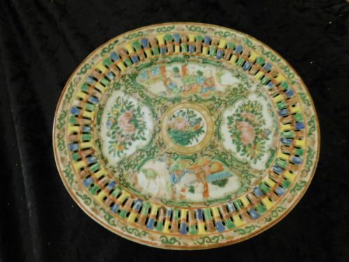 fig 1. A 19th-century Chinese Famille Rose reticulated porcelain chestnut basket with pierced lattice sides resting near a matching circular undertray.