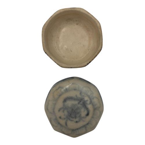 fig 4. An antique octagonal ceramic lidded box featuring cobalt blue hand-painted scrolling motifs against an off-white glaze.