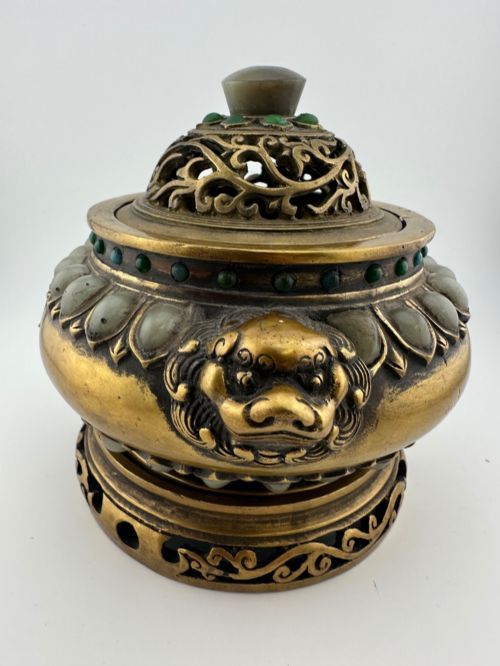 fig 3. An antique cast bronze Chinese censer featuring a pierced cover, beast-head handles, inlaid green hardstone petals, and a matching fitted bronze stand.