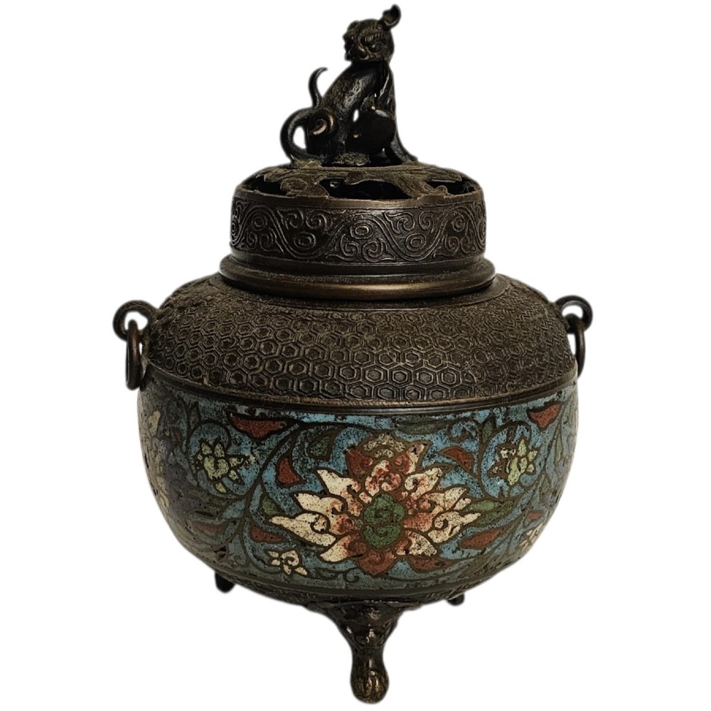 A 19th-century Chinese bronze tripod censer featuring polychrome cloisonne enamel floral motifs, side loop handles, and a lid topped with a Qilin finial.
