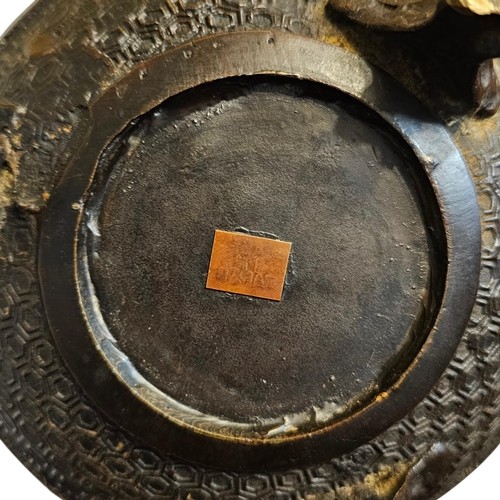 A 19th-century Chinese bronze tripod censer featuring polychrome cloisonne enamel floral motifs, side loop handles, and a lid topped with a Qilin finial. View IX
