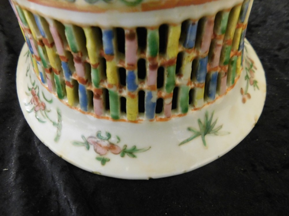 A 19th-century Chinese Famille Rose reticulated porcelain basket and matching pierced underplate decorated with polychrome floral and figurative motifs. View IV