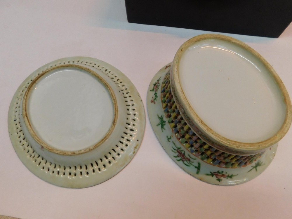 A 19th-century Chinese Famille Rose reticulated porcelain basket and matching pierced underplate decorated with polychrome floral and figurative motifs. View VII