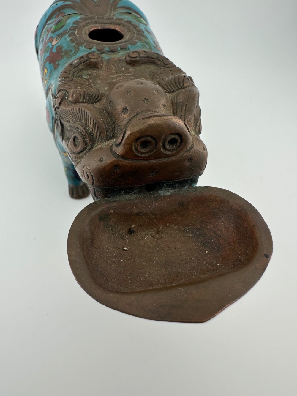 An antique Chinese bronze censer shaped as a mythical beast decorated with turquoise cloisonne enamel and colourful scrollwork. View II