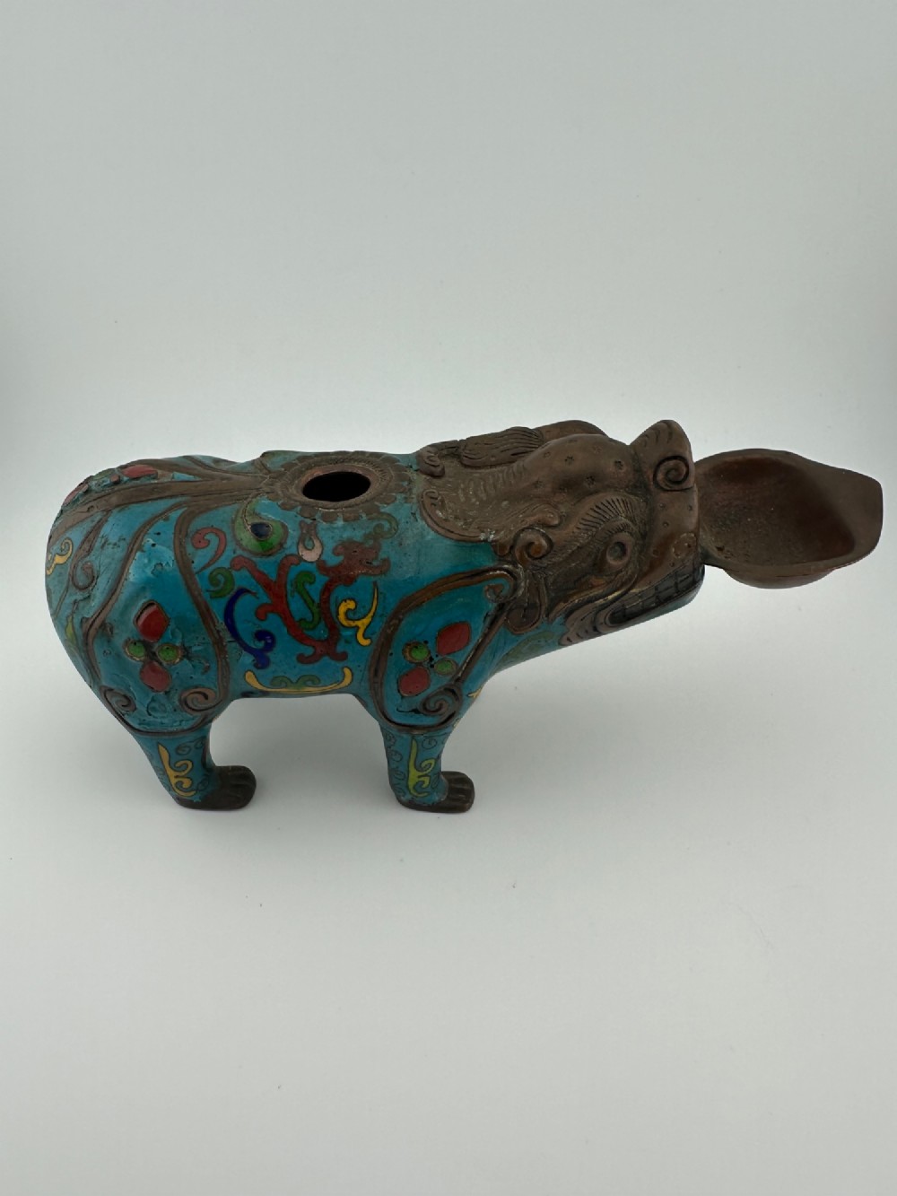 An antique Chinese bronze censer shaped as a mythical beast decorated with turquoise cloisonne enamel and colourful scrollwork. View III