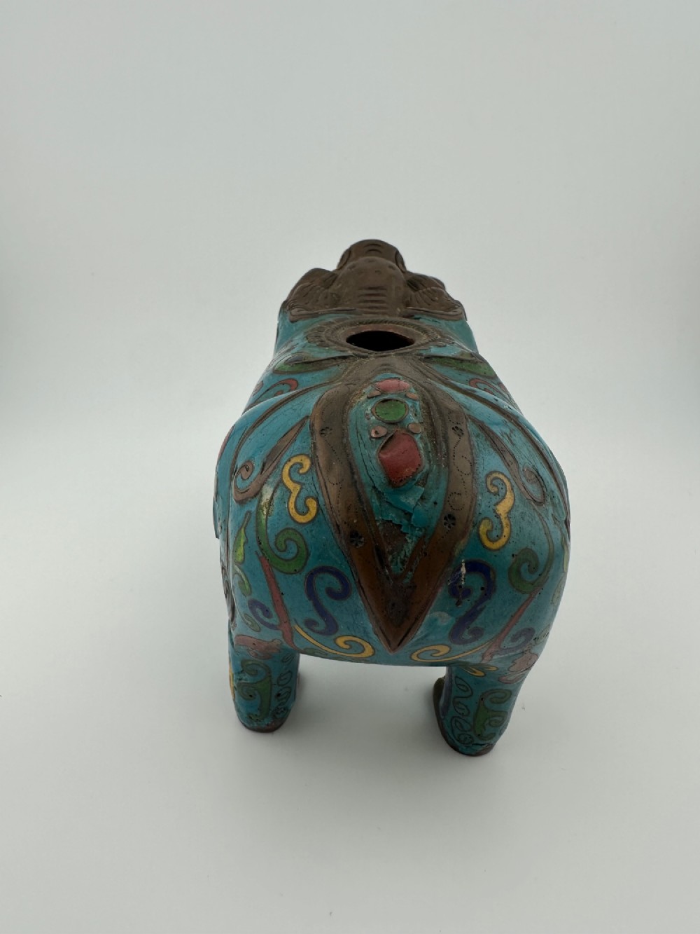 An antique Chinese bronze censer shaped as a mythical beast decorated with turquoise cloisonne enamel and colourful scrollwork. View V