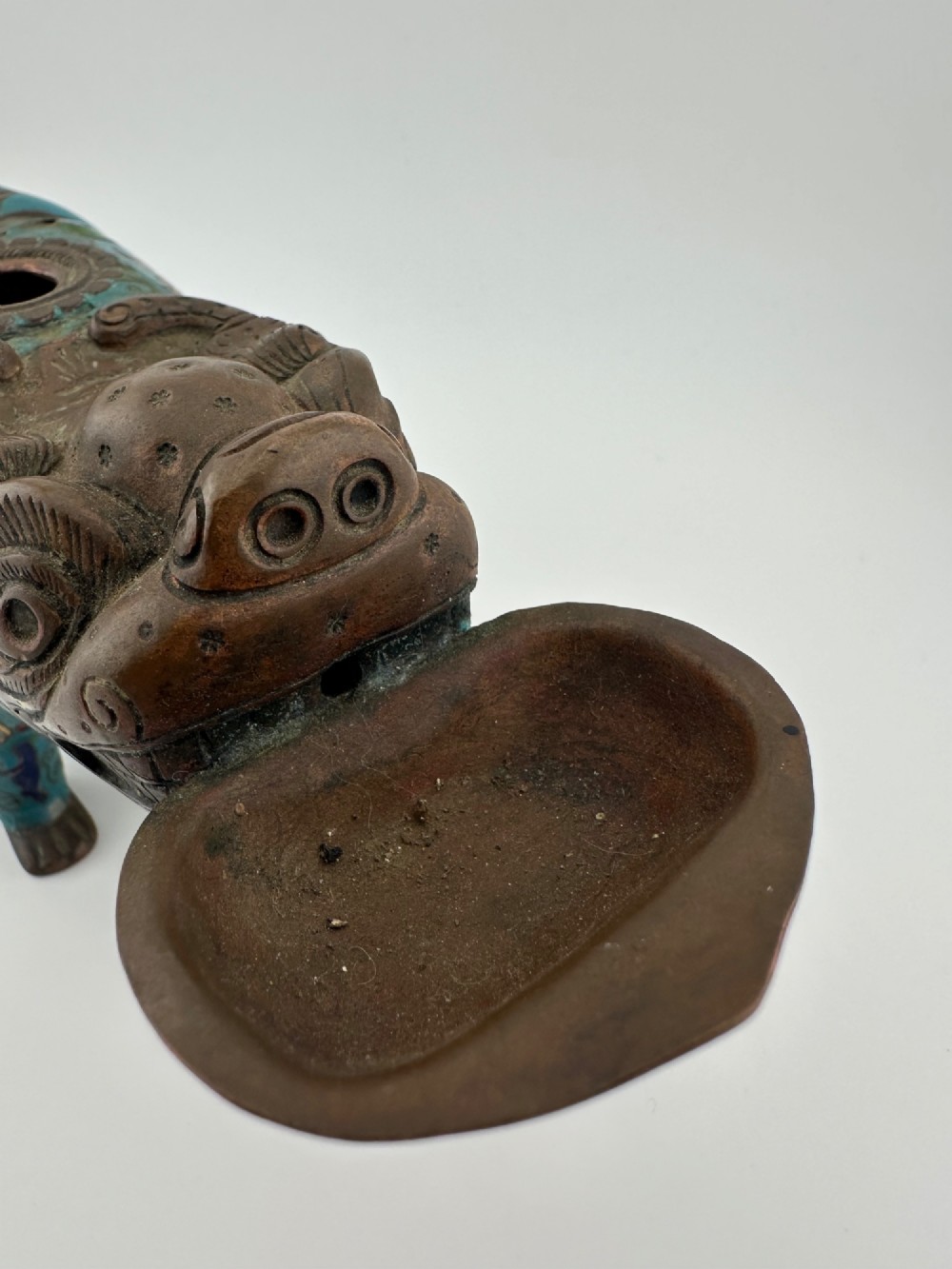 An antique Chinese bronze censer shaped as a mythical beast decorated with turquoise cloisonne enamel and colourful scrollwork. View X