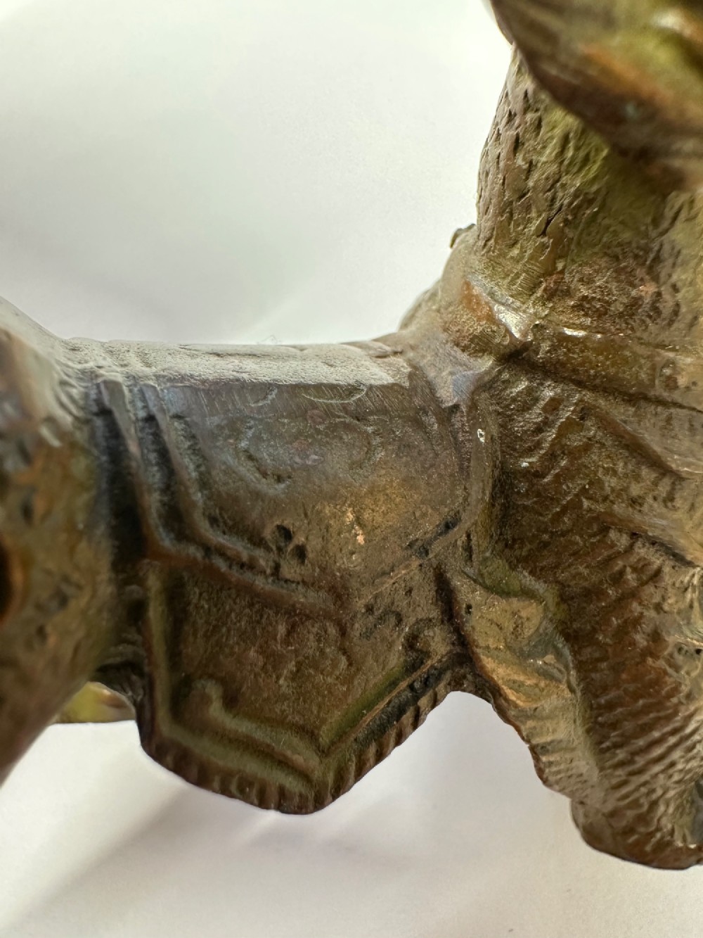 A small patinated dark brown bronze figure of a Chinese mythical beast, standing on four legs with an open mouth and raised tail. View XII